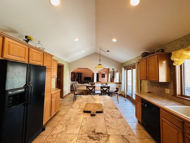 kitchen featuring arched walkways, tile countertops, lofted ceiling, black appliances, and light tile patterned flooring