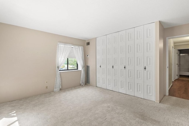 875 John Fitch Hwy Unit 23, Fitchburg, MA 01420 - unfurnished bedroom with carpet and a closet