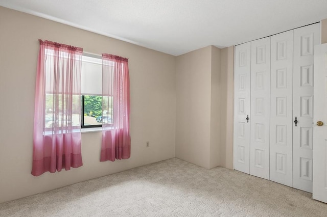 875 John Fitch Hwy Unit 23, Fitchburg, MA 01420 - unfurnished bedroom featuring carpet flooring and a closet
