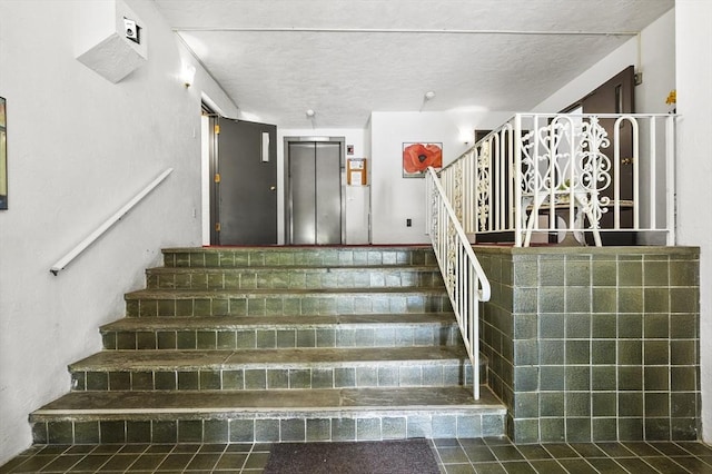 875 John Fitch Hwy Unit 23, Fitchburg, MA 01420 - stairway with elevator and a textured ceiling