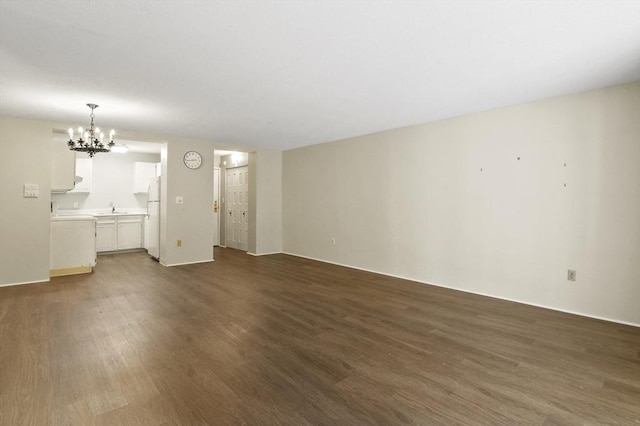 875 John Fitch Hwy Unit 23, Fitchburg, MA 01420 - unfurnished living room featuring a chandelier and dark wood-style flooring