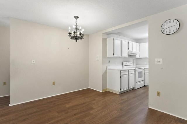 875 John Fitch Hwy Unit 23, Fitchburg, MA 01420 - kitchen with electric stove, under cabinet range hood, a chandelier, dark wood-style flooring, and light countertops