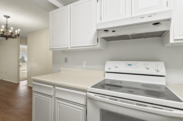 875 John Fitch Hwy Unit 23, Fitchburg, MA 01420 - kitchen with white electric range oven, under cabinet range hood, a chandelier, light countertops, and white cabinetry
