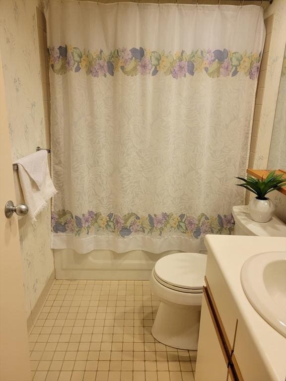 full bathroom featuring toilet, vanity, shower / bathtub combination with curtain, and tile patterned flooring