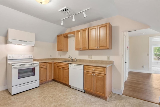 1123 E St, Ludlow, MA 01056 - kitchen featuring white appliances, rail lighting, a sink, vaulted ceiling, and light countertops