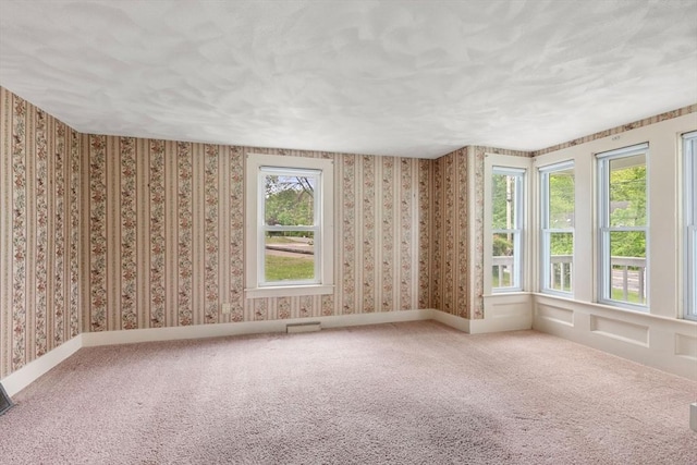 1123 E St, Ludlow, MA 01056 - carpeted empty room featuring wallpapered walls