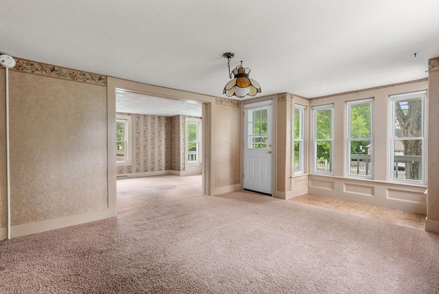 1123 E St, Ludlow, MA 01056 - carpeted spare room with wallpapered walls and a textured ceiling