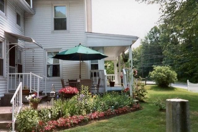1123 E St, Ludlow, MA 01056 - rear view of house with a lawn