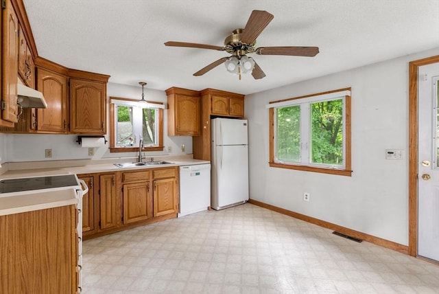 1123 E St, Ludlow, MA 01056 - kitchen featuring white appliances, a sink, light countertops, and light flooring
