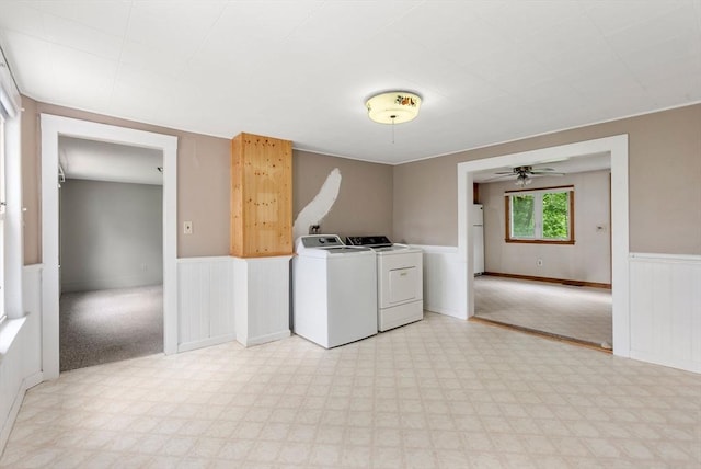 1123 E St, Ludlow, MA 01056 - laundry area with light floors, a wainscoted wall, washer and clothes dryer, and a ceiling fan