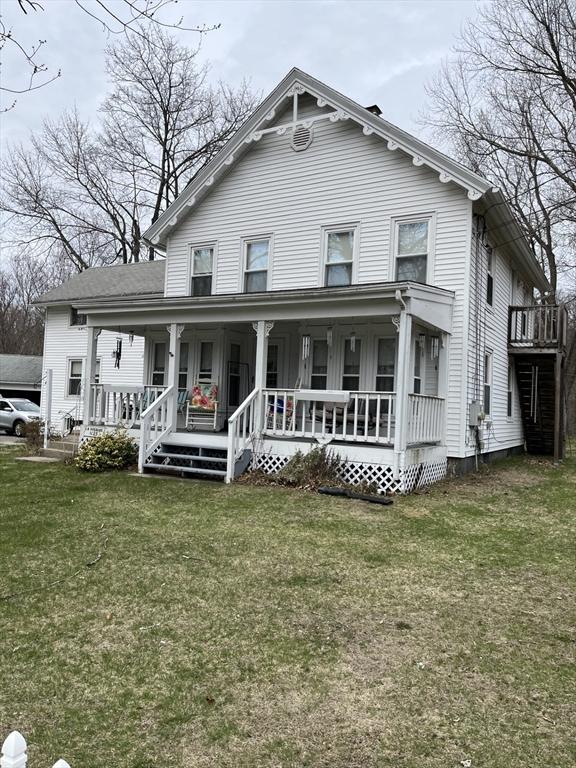 1123 E St, Ludlow, MA 01056 - back of property featuring a porch and a yard