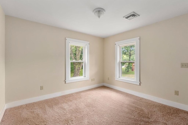 1123 E St, Ludlow, MA 01056 - carpeted empty room featuring plenty of natural light and baseboards