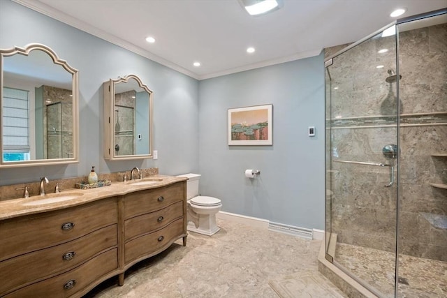 bathroom with toilet, ornamental molding, vanity, and walk in shower