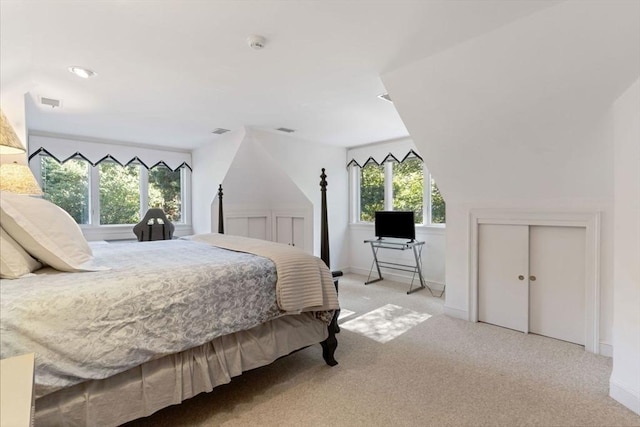 carpeted bedroom featuring a closet