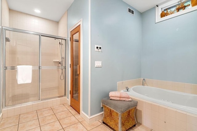 bathroom featuring tile patterned floors and shower with separate bathtub