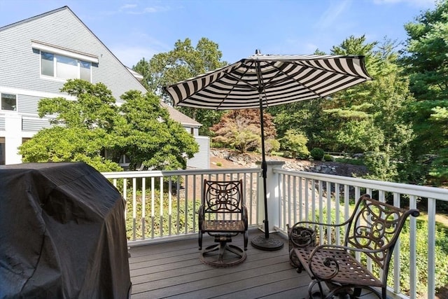 wooden terrace with area for grilling