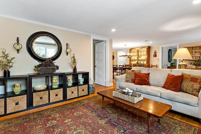 living room featuring ornamental molding and dark hardwood / wood-style floors