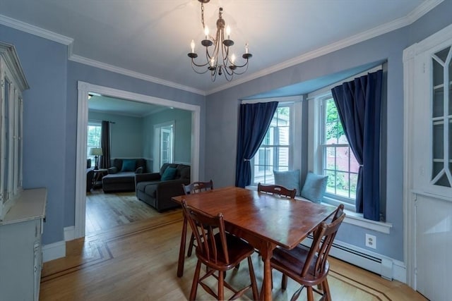 1349 Main St, Holden, MA 01520 - dining space with a chandelier, light wood finished floors, crown molding, baseboard heating, and baseboards