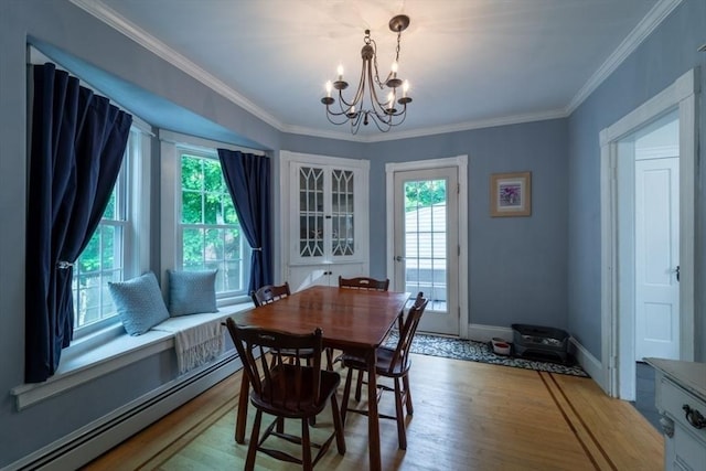 1349 Main St, Holden, MA 01520 - dining room featuring a baseboard heating unit, a chandelier, wood finished floors, baseboards, and crown molding