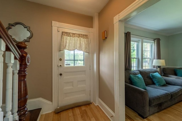 1349 Main St, Holden, MA 01520 - foyer featuring healthy amount of natural light, light wood finished floors, and crown molding