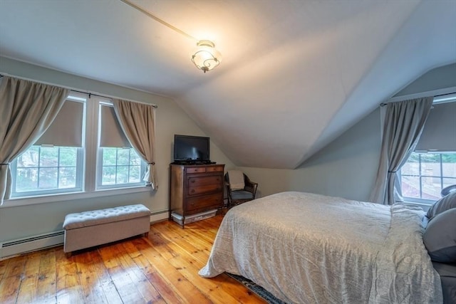 1349 Main St, Holden, MA 01520 - bedroom featuring hardwood / wood-style flooring, vaulted ceiling, and a baseboard radiator