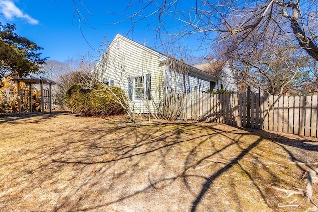 view of property exterior featuring fence