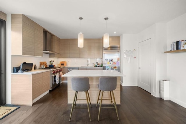 14 W Broadway Unit 903, Boston, MA 02127 - kitchen featuring wall chimney exhaust hood, high end appliances, light countertops, a sink, and a center island