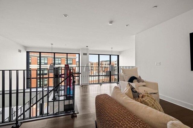 14 W Broadway Unit 903, Boston, MA 02127 - living area featuring dark wood-style floors and baseboards