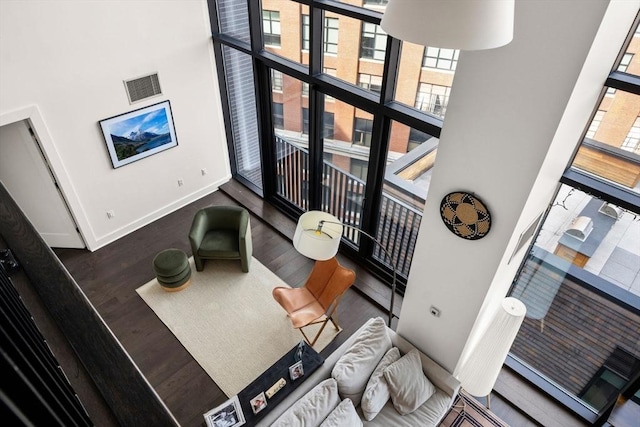 14 W Broadway Unit 903, Boston, MA 02127 - living area featuring a high ceiling, wood finished floors, and baseboards