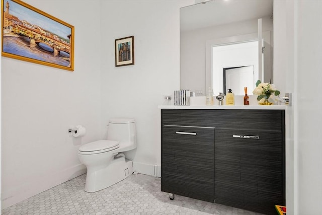 14 W Broadway Unit 903, Boston, MA 02127 - half bathroom featuring toilet, vanity, and baseboards