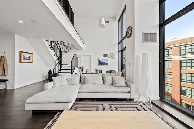 14 W Broadway Unit 903, Boston, MA 02127 - living room with a high ceiling, wood finished floors, stairway, baseboards, and recessed lighting