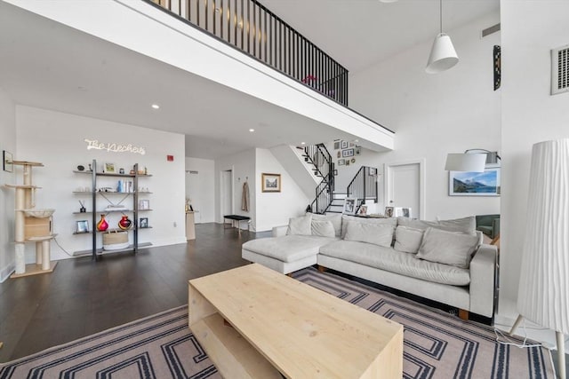 14 W Broadway Unit 903, Boston, MA 02127 - living room with wood finished floors, stairs, recessed lighting, a high ceiling, and baseboards