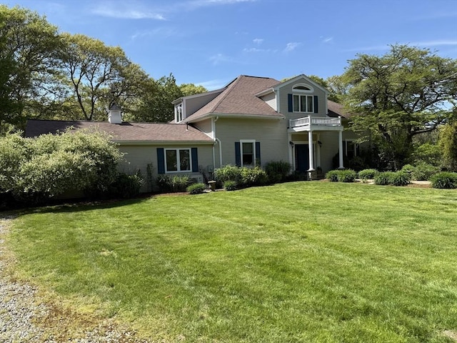 3 Wolf Rd, Bourne, MA 02532 - view of front facade featuring a front lawn, a balcony, and a shingled roof