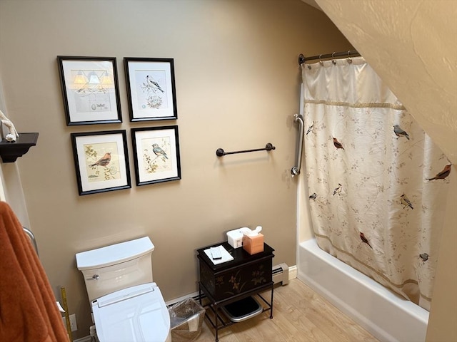3 Wolf Rd, Bourne, MA 02532 - full bath featuring wood finished floors, toilet, shower / bath combination with curtain, baseboard heating, and a baseboard heating unit