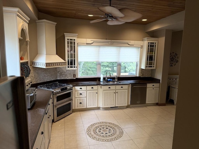 3 Wolf Rd, Bourne, MA 02532 - kitchen with premium range hood, appliances with stainless steel finishes, wooden ceiling, a sink, and cream cabinets