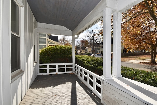 unfurnished sunroom with vaulted ceiling and wood ceiling