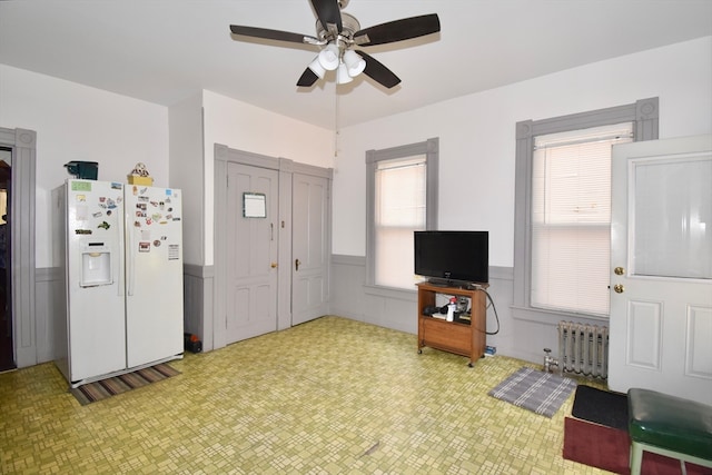 interior space featuring ceiling fan and radiator