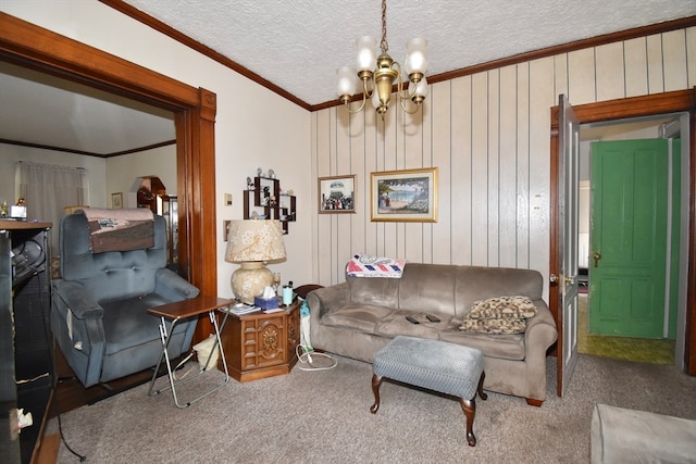 carpeted living room with a chandelier, crown molding, a textured ceiling, and wood walls