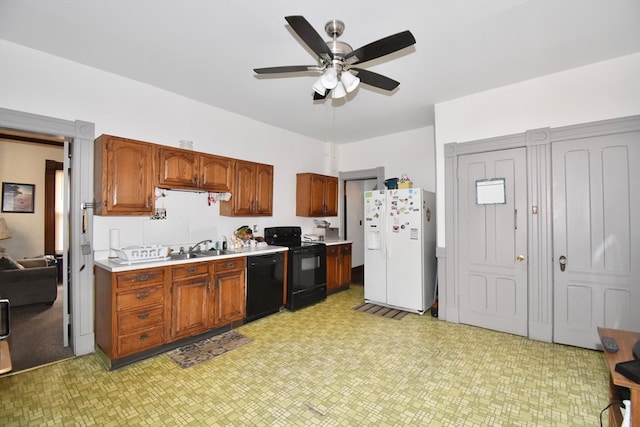 kitchen featuring sink, black appliances, and ceiling fan