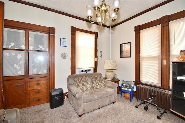 sitting room featuring light carpet, a textured ceiling, a chandelier, radiator, and ornamental molding