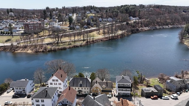 bird's eye view featuring a water view and a residential view