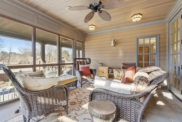 sunroom / solarium featuring wooden ceiling and a ceiling fan