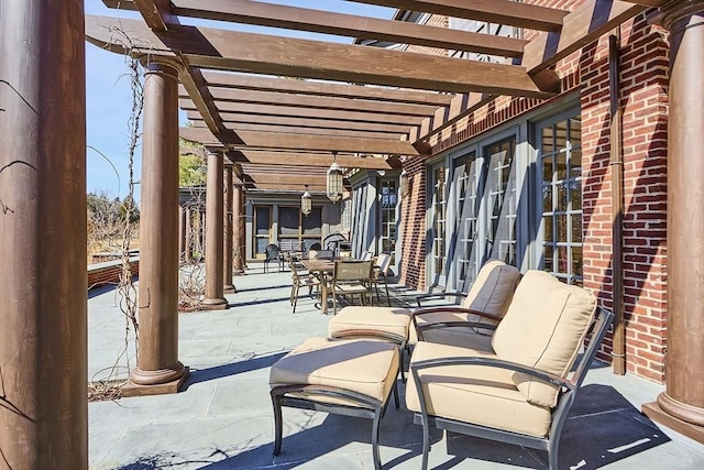 view of patio / terrace featuring outdoor dining space and a pergola