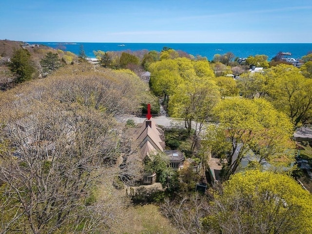 aerial view of property and surrounding area with a nearby body of water