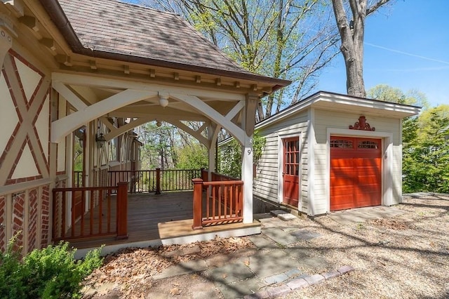 detached garage with a ceiling fan
