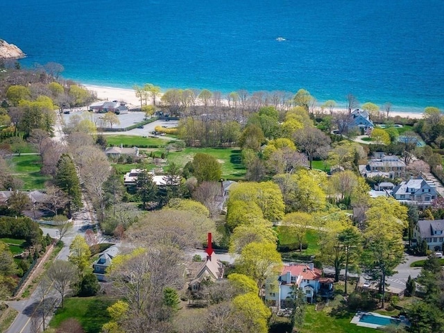 aerial overview of property's location with extended coastline and nearby suburban area