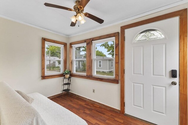 34 13th St, Wareham, MA 02532 - entrance foyer featuring baseboards, dark wood-type flooring, crown molding, and ceiling fan