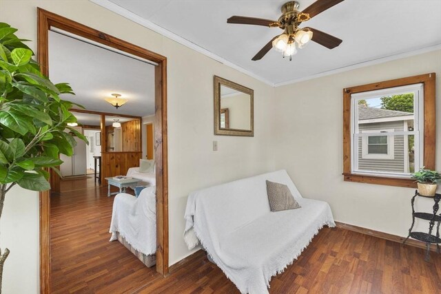 34 13th St, Wareham, MA 02532 - living area with wood finished floors, ornamental molding, a ceiling fan, and baseboards