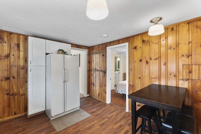 34 13th St, Wareham, MA 02532 - dining room featuring wood walls and dark wood-style floors