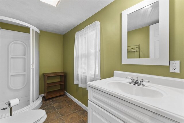34 13th St, Wareham, MA 02532 - full bathroom with baseboards, a shower stall, vanity, toilet, and stone finish flooring